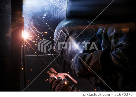 Arc welding of a steel in construction site 31670373