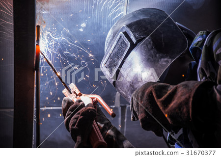Arc welding of a steel in construction site 31670377