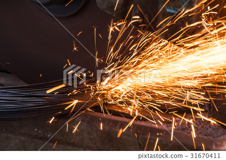 The sparkle of Metal cutting machine at work The sparkle of Metal cutting machine at work 31670411