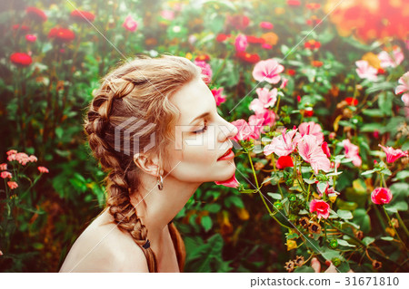 Woman in the summer garden Woman in the summer garden 31671810