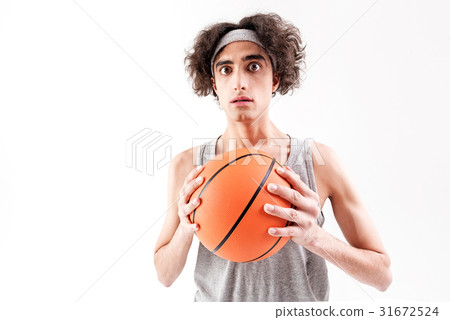Scared slim guy playing basketball Scared slim guy playing basketball 31672524