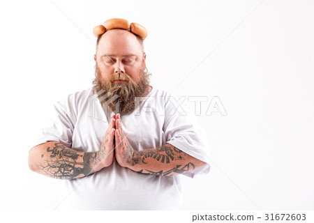 Calm male fatso praying about sausages 31672603