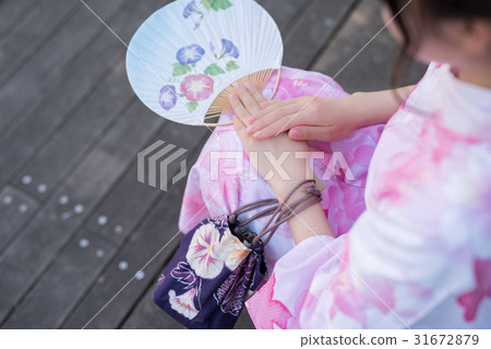 A woman walking through the streets of Hakata A woman walking through the streets of Hakata 31672879