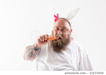 Sad fat man does not like healthy eating Sad fat man does not like healthy eating 31673049