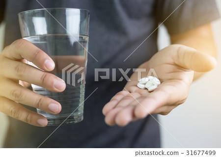man hand and water drug , Medicine ,Herbal pill, 31677499