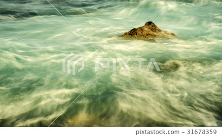 surf of the Atlantic ocean in long time exposure 31678359
