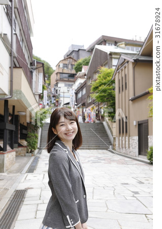 A young woman enjoying Ikaho (business woman style) A young woman enjoying Ikaho (business woman style) 31678924