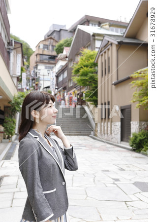 A young woman enjoying Ikaho (business woman style) A young woman enjoying Ikaho (business woman style) 31678929