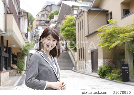A young woman enjoying Ikaho (business woman style) A young woman enjoying Ikaho (business woman style) 31678930