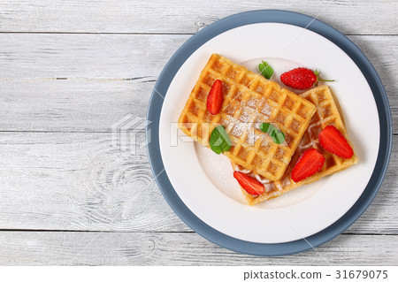 Belgian waffles with strawberries 31679075
