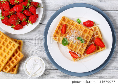 Belgian waffles with strawberries 31679077