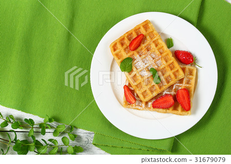 Belgian waffles with strawberries 31679079