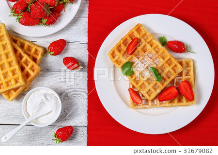 Belgian waffles with strawberries Belgian waffles with strawberries 31679082