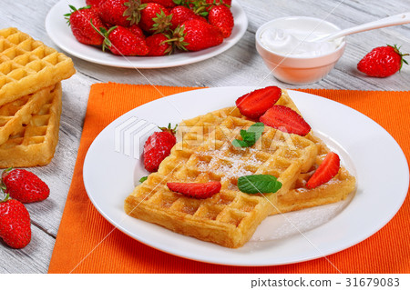 Belgian waffles with strawberries Belgian waffles with strawberries 31679083