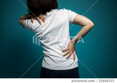 A woman with low back pain A woman with low back pain 31680335