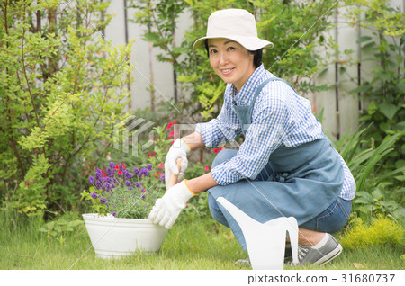 A woman enjoying gardening 31680737