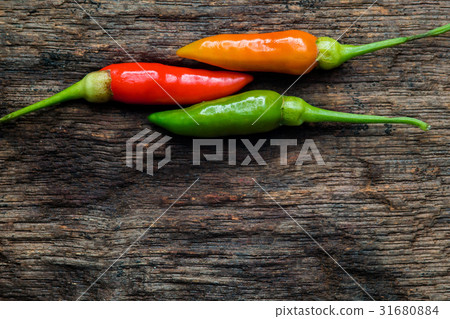 colorful of chilli on dark wood colorful of chilli on dark wood 31680884