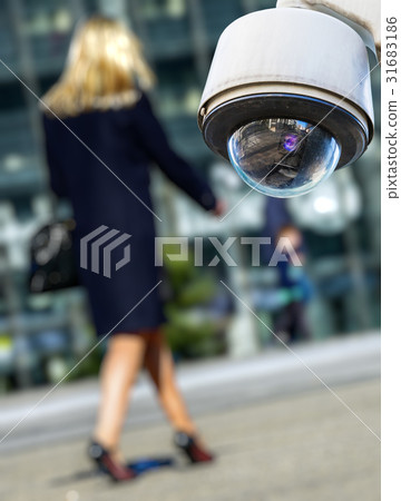 security CCTV camerawith woman on background 31683186