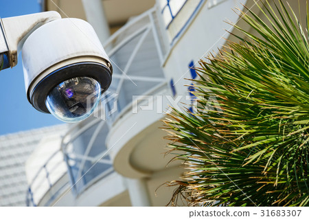 security CCTV camera with residence on background 31683307