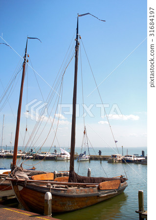 Moody shots of boats tied alongside the moorings 31684197