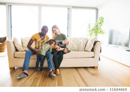 Young interracial family with little children at 31684669