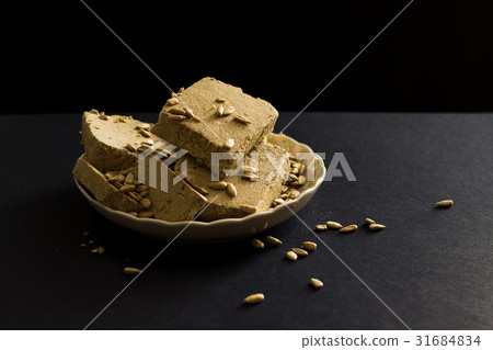 Sunflower halva with seeds on plate 31684834