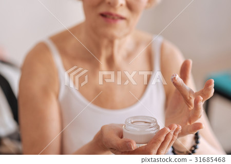 Model handing new useful cream Model handing new useful cream 31685468