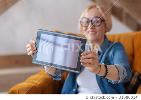 Close up photo of female hands that holding device 31686014