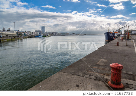 Seafront Ponta Delgada with the port. 31687728