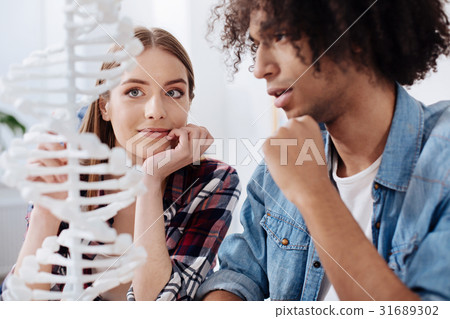 Attentive enthusiastic girl listening to friends Attentive enthusiastic girl listening to friends 31689302