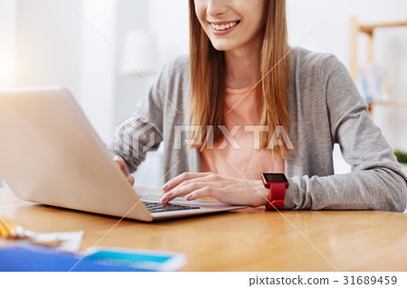 Motivated lively woman working on her assignment 31689459