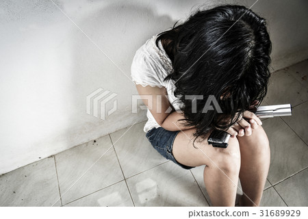 Sadness women with a handgun decided to suicide 31689929
