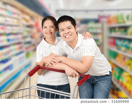 asian couple shopping in supermarket asian couple shopping in supermarket 31689999