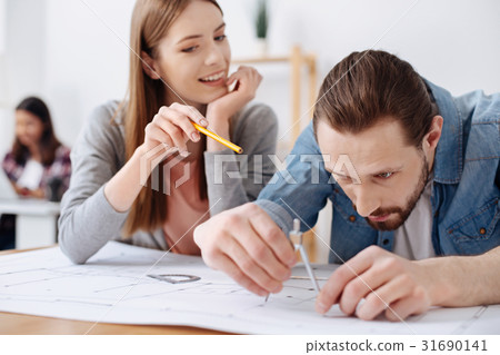 Adorable clever woman giving her colleague Adorable clever woman giving her colleague 31690141