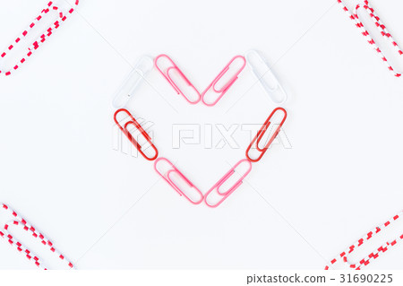 heart shape by paper clips on white background heart shape by paper clips on white background 31690225