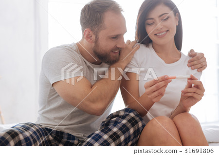 Portrait of excited married couple looking at 31691806