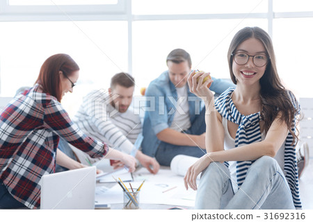 Happy joyful woman holding an apple 31692316