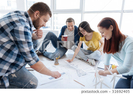 Positive delighted people working in team Positive delighted people working in team 31692405