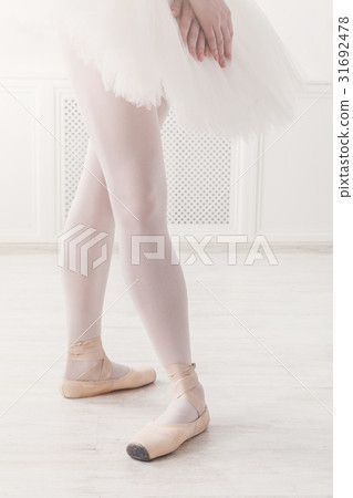 Ballerina legs closeup in fourth position 31692478