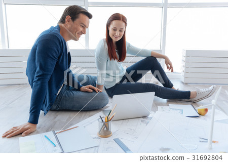 Happy positive people sitting in front of the Happy positive people sitting in front of the 31692804