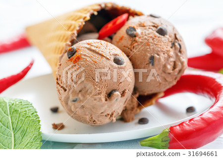Balls of homemade chocolate ice cream with chilli. 31694661