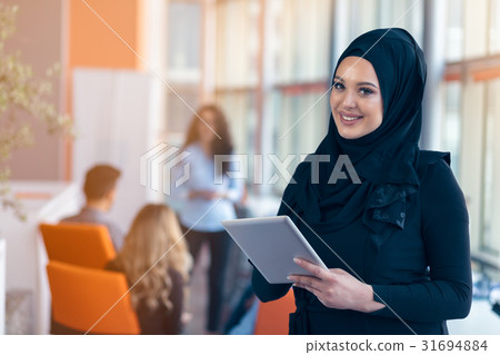 beautiful Arabian girl with tablet computer beautiful Arabian girl with tablet computer 31694884