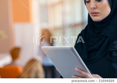 beautiful Arabian girl with tablet computer 31694889