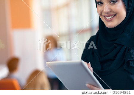 beautiful Arabian girl with tablet computer 31694891