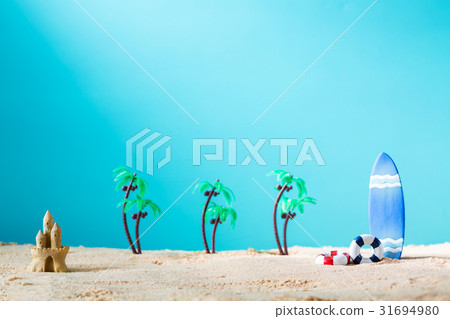 Summer theme with surfboard and sand castle 31694980