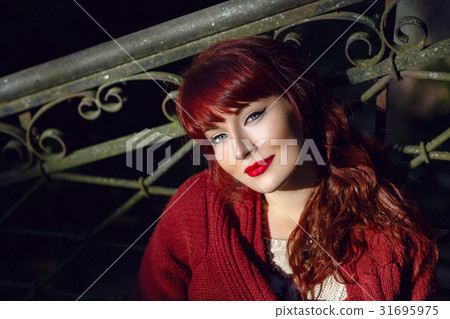 Girl sitting on old house stairs Girl sitting on old house stairs 31695975