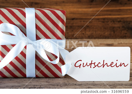 Present With Label, Gutschein Means Voucher Present With Label, Gutschein Means Voucher 31696559