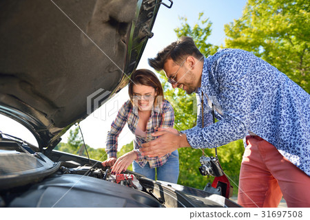 Young couple on the road has problems with their 31697508