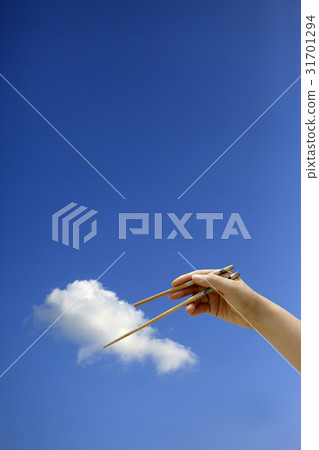 Hand, chopsticks, clouds Hand, chopsticks, clouds 31701294