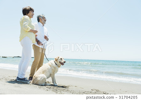 Senior couple and dog beach Senior couple and dog beach 31704205